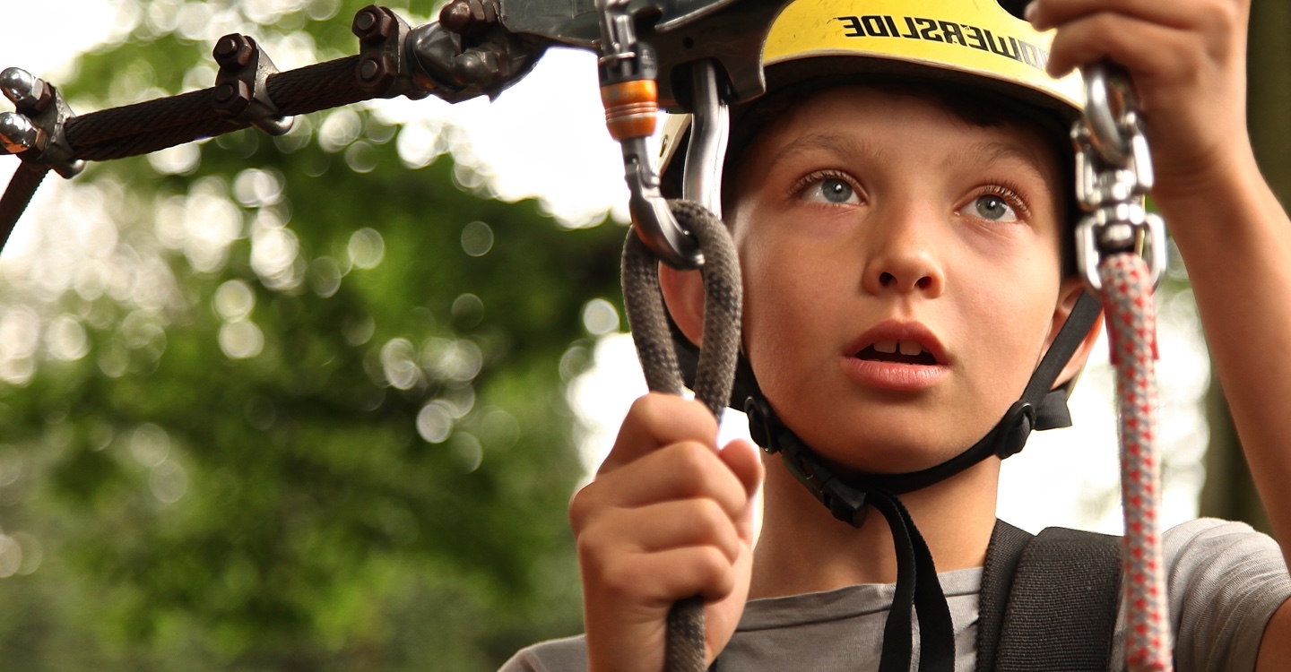 YMCA Youth Young boy plays on rope course