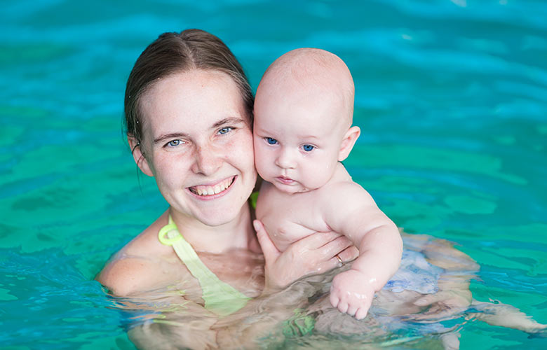 YMCA Swim Lessons Mother holding baby in water