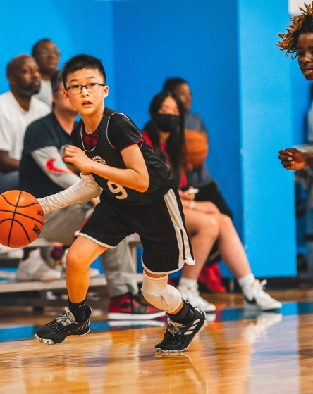 Beaverton Family YMCA - Kid playing basketball